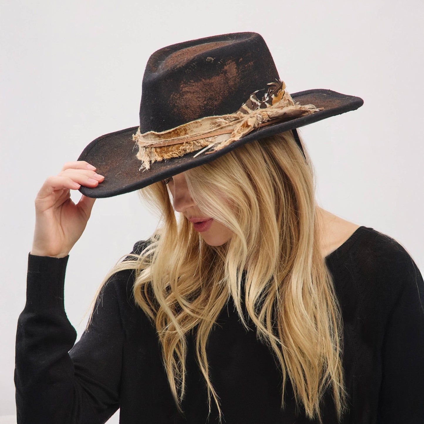 Rustic Cowgirl with Feather Fedora Hat