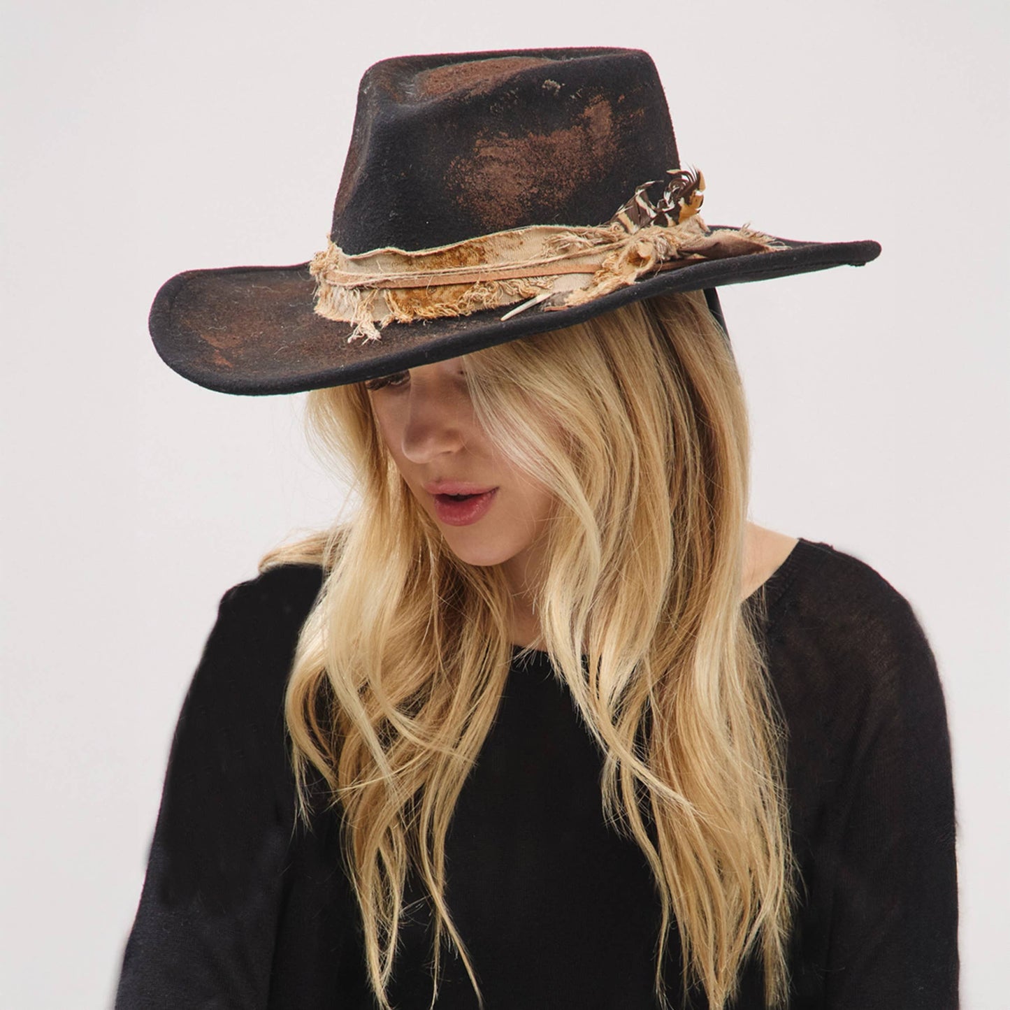 Rustic Cowgirl with Feather Fedora Hat