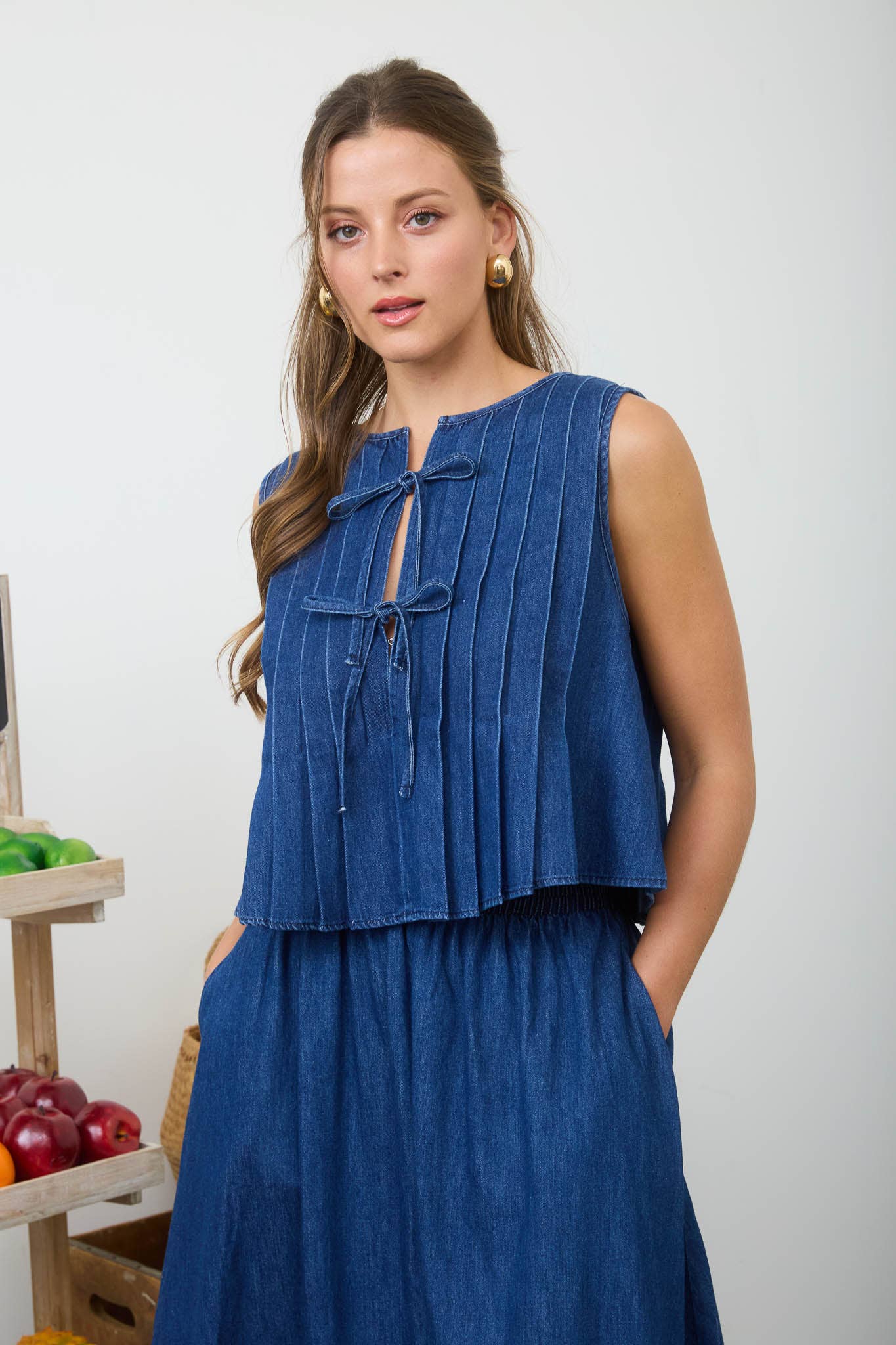 FRONT TIE PINTUCK DETAIL SLEEVELESS DENIM BLOUSE